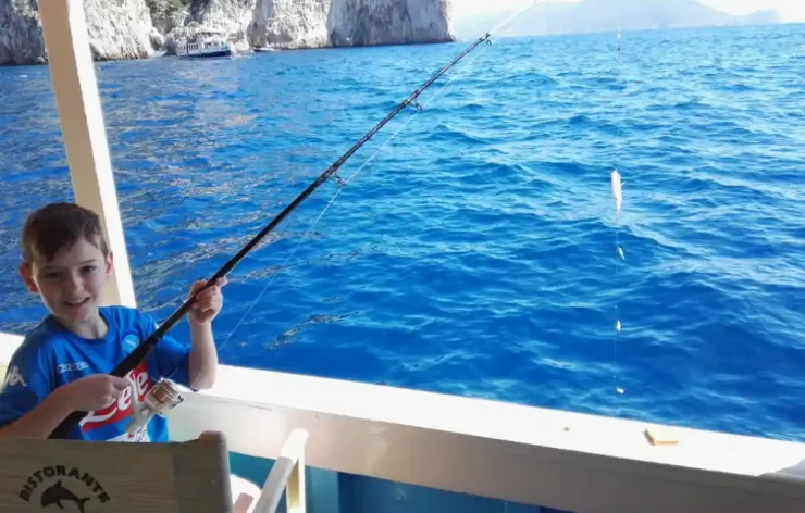 Fishing, Swimming & Relaxing On Boat With Lunch In Sorrento and Capri Coasts Italy
