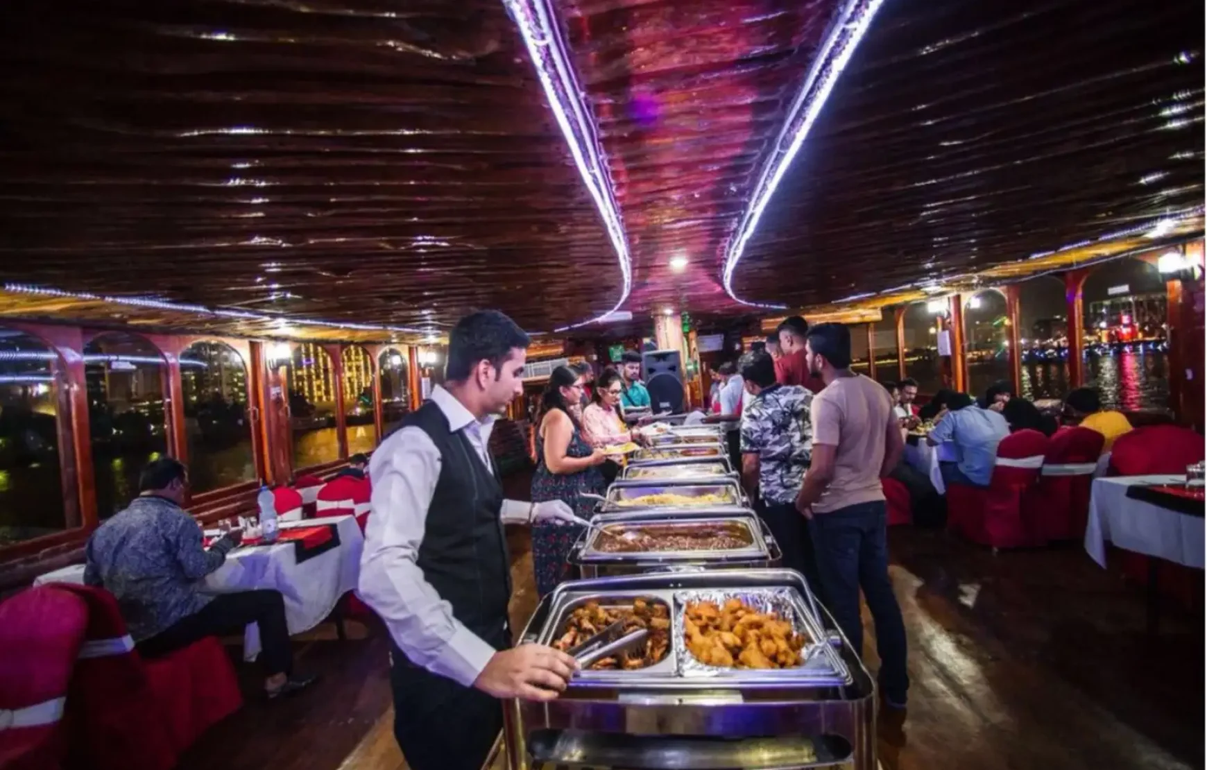 Dinner-on-Traditional-Wooden-Boat-Cruise-in-Dubai-Creek Dinner-on-Traditional-Wooden-Boat-Cruise-in-Dubai-Creek